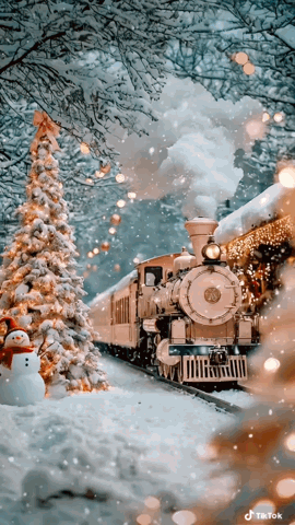 A Train Is Pulling Into A Station With A Christmas Tree And Snowman In The Foreground GIF