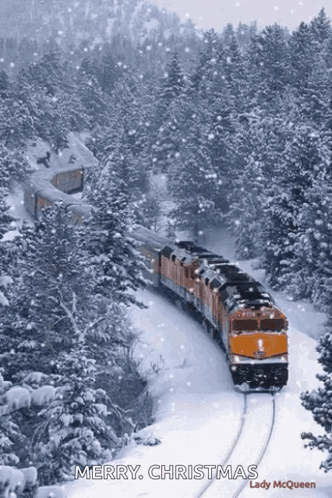 A Train Traveling Through A Snowy Forest With The Words Merry Christmas Written On The Bottom GIF
