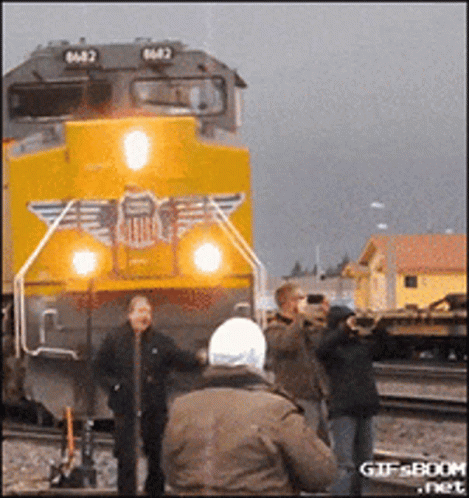 A Train With The Number 6482 On The Front GIF