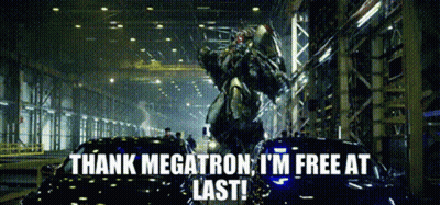 A Transformer Is Standing Next To A Car And Says Thank Megatron I 'M Free At Last ! GIF