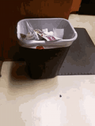 A Trash Can On The Floor With A Sticker That Says ' I 'M Mad ' GIF
