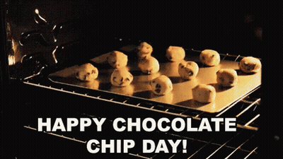 A Tray Of Chocolate Chip Cookies In An Oven With The Words Happy Chocolate Chip Day Below Them GIF