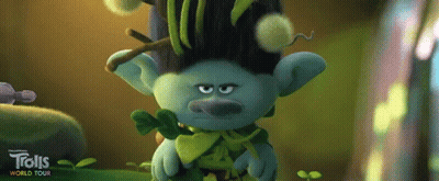 A Troll From Trolls World Tour Is Holding A Plant In His Hands GIF