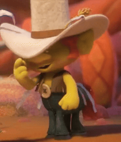 A Troll Wearing A Cowboy Hat And Pants Is Standing On A Table GIF