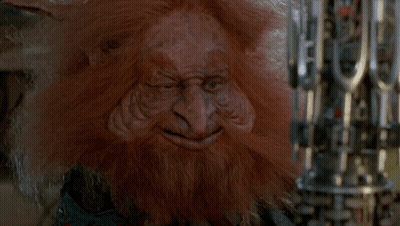 A Troll With A Beard Is Holding A Machine Gun GIF