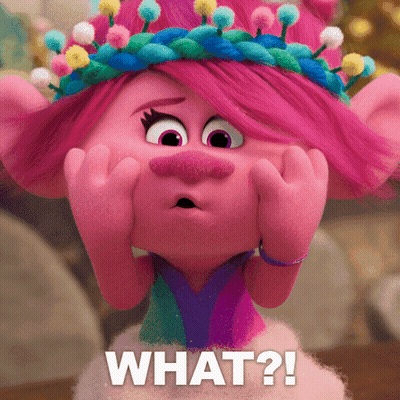 A Troll With A Crown On Her Head And The Words What Written Below Her GIF