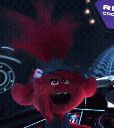 A Troll With A Crown On Her Head Is Sitting In Front Of A Crown Club Sign . GIF