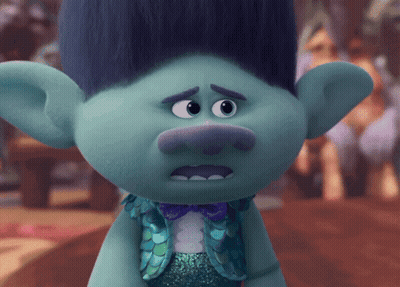 A Troll With Blue Hair And A Bow Tie GIF