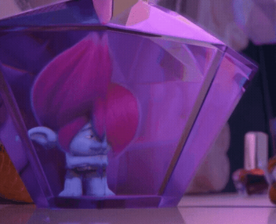 A Troll With Pink Hair Is Inside Of A Purple Container GIF
