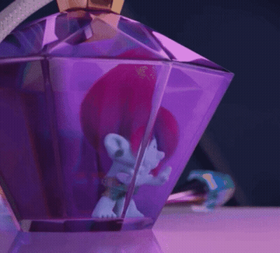 A Troll With Pink Hair Is Sitting Inside Of A Purple Bottle GIF