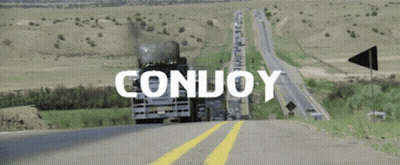 A Truck Is Driving Down A Highway With The Word Conuoy Written On It GIF