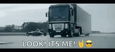 A Truck Is Driving Down A Road With The Words Look It 'S Me Written On The Bottom GIF