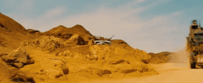 A Truck Is Driving Through A Desert Landscape GIF