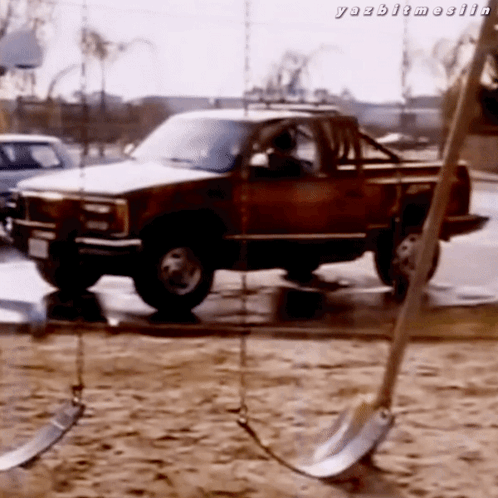 A Truck Is Parked In A Sandy Area With The Words Yazbitmeelin Written Below It GIF