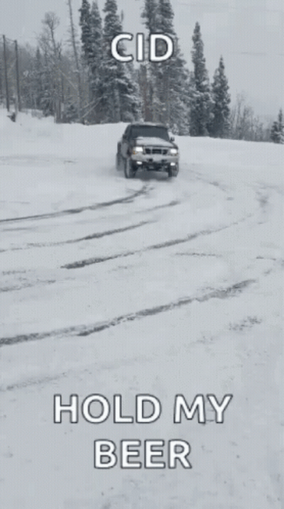 A Truck Is Parked In The Snow With A Caption That Says " Hold My Beer " GIF