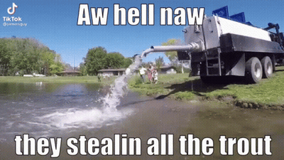 A Truck Is Pumping Water Into A Body Of Water . GIF