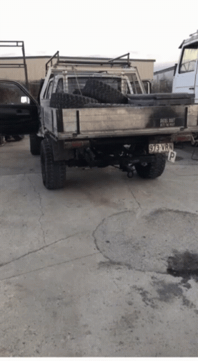 A Truck With A License Plate That Says 93 Vwp Is Parked In A Parking Lot GIF