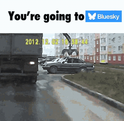 A Truck With The Year 2012 On The Back Is Driving Down A Street GIF