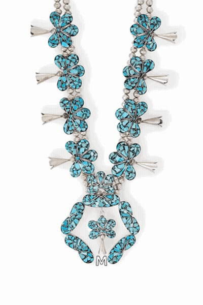 A Turquoise And Silver Circle With The Letter M Underneath It GIF