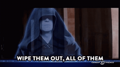 A Tv Screen Shows A Man In A Hood And Says Wipe Them Out All Of Them GIF