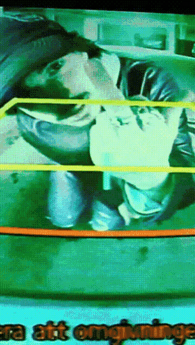 A Tv Screen Shows A Man In A Wrestling Ring And The Words " Era Att Omgivningen " GIF