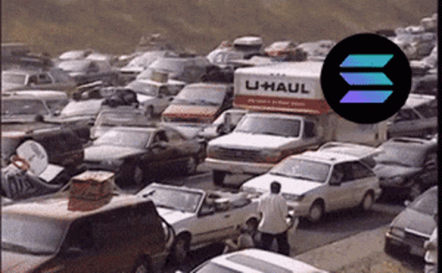 A U-Haul Truck Is In The Middle Of A Parking Lot GIF