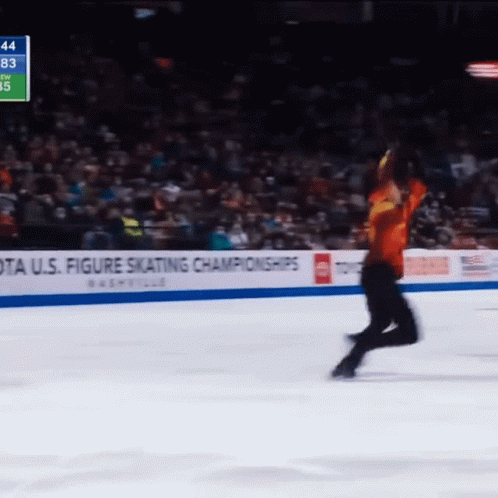 A U.s. Figure Skating Championships Sign Is Behind A Skater GIF