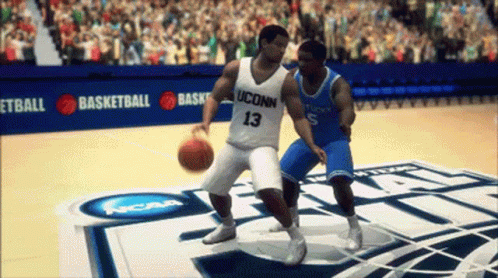 A Uconn Basketball Player Dribbles A Basketball While Another Player Tries To Stop Him GIF