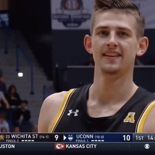 A Uconn Basketball Player Smiles During A Game Against Kansas City GIF