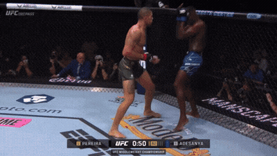 A Ufc Fight Between Pereira And Adesanya Is Being Shown On A Screen GIF
