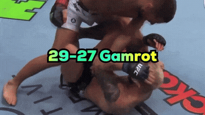 A Ufc Fighter Is Being Pinned By Another Fighter GIF