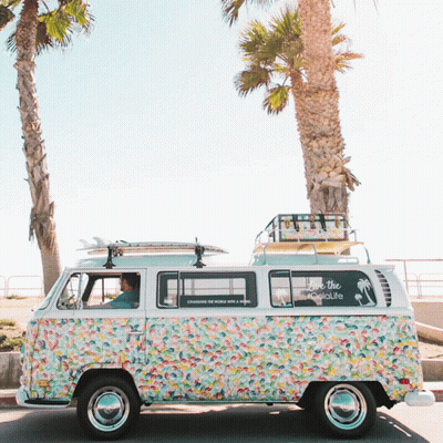 A Van With A Sticker On The Side That Says " Love The Tikilife " GIF