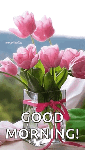 A Vase Filled With Pink Flowers And The Words `` Good Morning '' Written On It . GIF