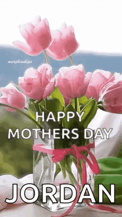 A Vase Filled With Pink Flowers Is On A Table And Says `` Happy Mothers Day Jordan '' . GIF