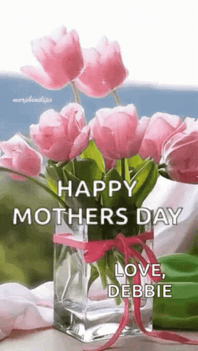 A Vase Filled With Pink Flowers With The Words `` Happy Mother 'S Day Love , Debbie '' Written On It . GIF