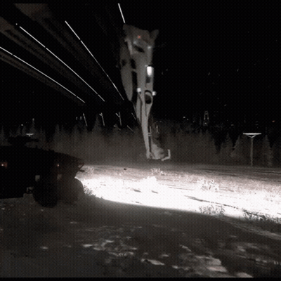 A Vehicle Is Driving Through The Snow At Night GIF