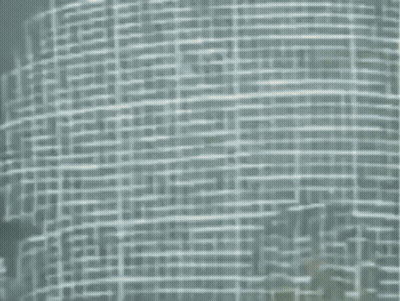 A Very Blurry Picture Of A Building With A Lot Of Lines GIF