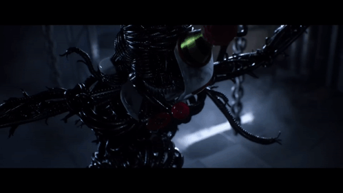 A Very Dark Room With A Very Strange Looking Object GIF