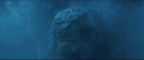 A Very Large Monster Is Swimming In The Water And Looking At The Camera GIF