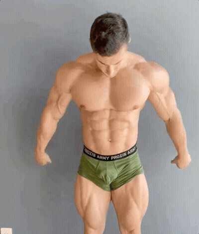 A Very Muscular Man Wearing Green Prozis Army Underwear GIF