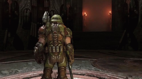 A Video Game Character Is Holding A Gun And Giving A Thumbs Up . GIF