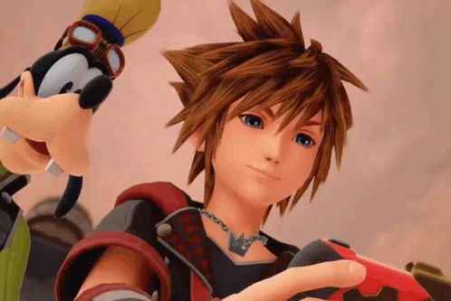 A Video Game Character Is Holding A Red Controller Next To A Goofy Character GIF