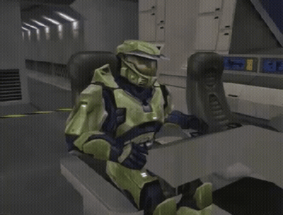 A Video Game Character Is Sitting In A Chair With A Display That Says ' 00 ' GIF