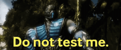 A Video Game Character Says Do Not Test Me In Yellow Letters GIF