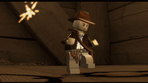 A Video Game Character Says " You Idiot " In Orange Text GIF