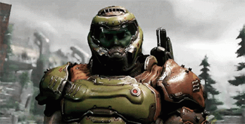 A Video Game Character Wearing A Helmet And Armor Holding A Gun GIF