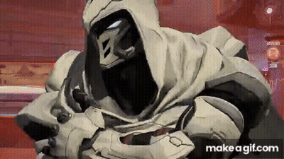 A Video Game Character With A Hood On His Head Is Standing In A Room With A Red Background . GIF