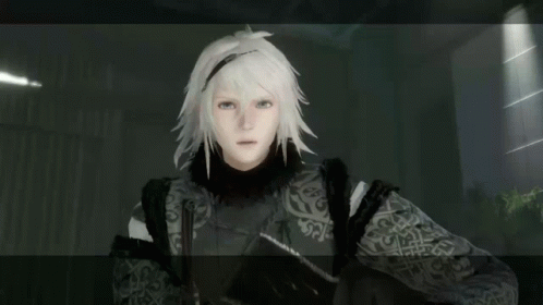A Video Game Character With White Hair And A Black And White Patterned Jacket GIF