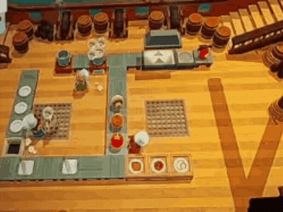 A Video Game Is Being Played On A Wooden Table GIF