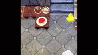 A Video Game Scene With A Table And Plates On It GIF